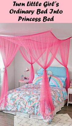 a pink canopy bed with unicorns on it