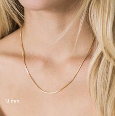 A timeless classic and jewelry staple, these chic chains are exquisitely crafted with gleaming solid 14K gold. The box link chain is known for its link strength and beautiful sheen. It is the perfect chain on its own or for layering with other necklaces. D E T A I L S ⚬ Crafted with 14K pure Solid Gold, NOT Plated, NOT Hollow, NOT Filled. They are water-resistant, tarnish-resistant, and hypoallergenic. ⚬ Stamped "14K" for Authenticity⚬ Lobster claw makes it easy to use closure.⚬ Offered in 0.6mm Minimalist 14k Gold Snake Chain Necklace Gift, Classic 14k Gold Snake Chain Necklace As A Gift, Classic 14k Gold Snake Chain Necklace For Gift, Classic Yellow Gold Delicate Snake Chain Necklace, Minimalist Yellow Gold Snake Chain Necklace As Gift, Jewelry Staples, Box Chain Necklace, Gold Box, Box Chain