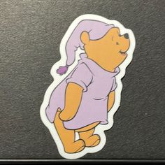 a sticker with the image of winnie the pooh on it's back