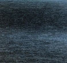 an area rug that looks like it is in the middle of dark blue sea water