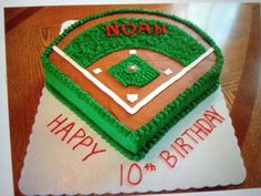 a baseball themed birthday cake with the number 10 on it's base and field