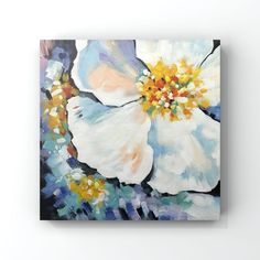 an abstract painting of white flowers with yellow and blue petals on the petals is shown