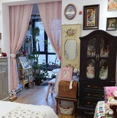 a living room filled with furniture and lots of windows