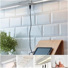 an electronic device is plugged in to a wall mounted power strip and attached to a wooden shelf