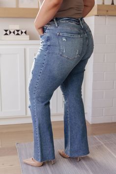 If you've got a flair for the dramatic, look no further than the Kiana Heavy Destroy Flare Jeans from Judy Blue! These amazing jeans feature a stretchy medium wash denim, that shapes a hi-rise with a five pocket cut, and zipper fly that drops into a heavy distressed leg with a raw flare hem. Pair these amazing jeans with a graphic tee, heeled boots, and a wide brim hat for a cute boho look!

Judy Blue
High Rise
Zip Fly
4-Way Stretch
Heavy Distressing
Wide Flare Leg
94% Cotton, 5% Polyester, 1% S Mid-rise Distressed Medium Wash Flare Jeans, Flare Distressed Denim Jeans, Distressed Flare Denim Jeans, Distressed Denim Flare Jeans, Mid-rise Distressed Denim Blue Flare Jeans, High Rise Dark Wash Denim Flares, Dark Wash Denim Flares With Frayed Hem, Fall Denim Distressed Flares, Fall Distressed Denim Flares