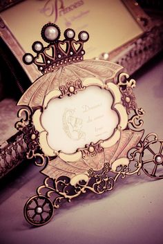 an ornate photo frame is sitting on a table