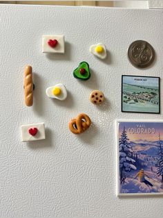 the magnets on the refrigerator are decorated with food and other things to decorate them