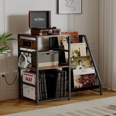 an entertainment center with record players and records