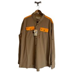 New Duck Camp Tan And Orange Hunting Button Up Shirt Men's Size Xx-Large Nwt Upf 40+ Double Button Pockets On The Front Of The Shirt Zipper Side Pocket On The One Of The Front Pockets Mesh Flap At The Top Of The Shirt Sleeves Have Button To Be Able To Roll Up Easily Size Xx-Large New With Tags Vietnam Clothes, Camp Shirts, Ermenegildo Zegna Men, Vans T Shirt, Tommy Hilfiger Vintage, Hoodie Logo, Raglan Pullover, Button Up Shirt Mens, Denim And Supply