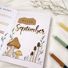 an open notebook with the words hello september written on it