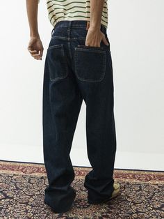 This is a unique denim pants that has a tone on tone contrasting color detail on the front and back. Made out if rigid denim and cotton twill fabric, it is sturdy and has a soft touch. It will stand out from your trendy steetwear outfit. - Wide fit silhouette- Rigid denim and cotton twill fabric- Back patch pockets Dark Wash Rigid Denim Cargo Jeans With Contrast Stitching, Cargo Jeans In Dark Wash With Contrast Stitching, Dark Wash Cargo Jeans With Contrast Stitching, Urban Dark Wash Jeans With Hip Pockets, Dark Wash Jeans With Contrast Stitching, Denim Blue Wide Leg Cargo Jeans With Contrast Stitching, Wide Leg Denim Blue Cargo Jeans With Contrast Stitching, Recycled Denim Pants With Relaxed Fit, Modern Jeans For Streetwear With Pockets