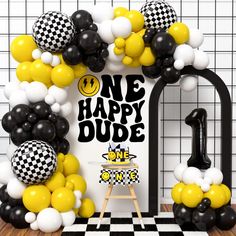 a black and white birthday party with balloons in the shape of numbers one, happy dude