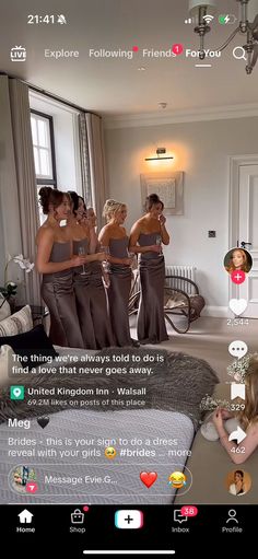 a group of women in brown dresses standing next to each other on a bed with white walls