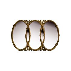 three oval mirrors sitting next to each other