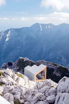 a small house on top of a mountain