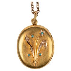 This rare Russian 14k yellow gold locket from St. Petersburg, circa 1900 was created during the Romanov era of Tsar Nicholas II. The front of the oval yellow gold locket applied with a rose gold bouquet set with rose diamonds and turquoise cabochons, opening to reveal two vacant compartments. Stamped St. Petersburg, 1899-1908. 1 9/16 in. ( 4 cm.) long including suspension ring; locket measures 1 3/16 x 1 x 1/4 in. (3 x 2.5 x .6 cm.) (l x w x h). Chain not included. For a Russian imperial-era 25 inch gold rope chain see Ref no. CHFD097B. Ring Locket, Rose Gold Bouquet, Gold Bouquet, Diamond Locket, Gold Locket Necklace, Tsar Nicholas Ii, Tsar Nicholas, Gold Rope Chains, Gold Locket