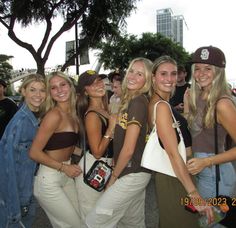 a group of young women standing next to each other