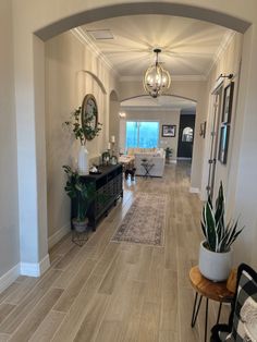 the hallway is clean and ready for guests to use it as an entrance way in this home