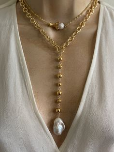 Statement pearl necklaces. Sold separately. 1. Pearl Lariat features gold plated stainless steel oval links chain and combination of 8mm and 6mm gold plated stainless Steel beads. Extra large baroque pearl. Pearl size approximately 22mmx15mm. Necklace length around the neck adjustable 16.5-18.5 inches. Drop 5 inches. 2. Claw charm features gold plated stainless steel claw charm and small baroque pearl. 18k gold plated brass rolo chain. Adjustable length 16-18 inches. 🎁All orders are shipped in Elegant Baroque Pearl Chain Jewelry, Gold Long Baroque Pearl Necklace, Baroque Pearl Lariat Necklace With Pendant, Gold Baroque Pearl Lariat Necklace, Baroque High Luster Gold Pearl Necklace, Pearl Neck, Edwardian Necklace, Jewelry Pearls, Pearl Charm Necklace