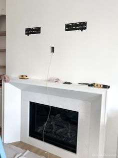 an electric fireplace is being installed in the living room