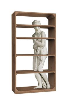 a white statue sitting on top of a wooden book shelf next to a white wall