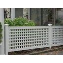 a white fence with plants growing on it in front of a house and window sill