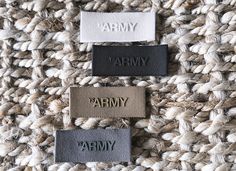 three different colored labels that say army, army and army written on them in black