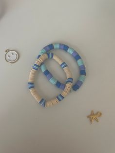 Blue Preppy Bracelets Fitting For any outfit! Stretchy elastic!! 2 Bracelets! 🌊 Aesthetic and preppy?? You got it! Right here!💗  Looking for handmade/homemade jewelry? Wel you came to the perfect place: Bracelet Bae Boutique! In my shop you will find beach, tropical, preppy, aesthetic, and more styled jewelry all for a good price! More details about my jewelry: Product information:  -Made by myself -clay beads -seed beads -faux pearls -golden beads -very stretchy elastic -golden chain ♡Shipped from PA in the USA♡ -Sizing on bracelets will be provided on the sizing option. If not please message or contact me. The owner or bracelet bae boutique. -Made in a clean area. -Made from all skin friendly materials If you have any questions or concerns on a product please message me! Main etsy page Bracelet Colors Clay Beads, Clay Bead Bracelet Ideas Minimalist, Clay Bead Bracelet Ideas With Gold Beads, Poly Clay Bead Bracelet, Cute Clay Bead Bracelet Ideas Green, Inspo For Clay Bead Bracelets, Clay Bead Necklace With Shell, Clay Bead Bracelet Ideas Tsitp, Clay Bead Craft Ideas