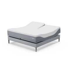 an image of a bed with a mattress on it's side and no sheets