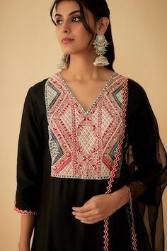 Black chanderi kurta with tribal embroidery. Comes with pant and a scalloped dupatta. - Aza Fashions Designer Embroidered Palazzo Set For Navratri, Festival Chanderi Sets, Bohemian Anarkali Set With Embroidered Border For Designer Wear, Bohemian Anarkali Set With Embroidered Border, Bohemian Palazzo Set With Motifs For Festive Occasions, Eid Designer Wear Kurta With Woven Motifs, Bohemian Anarkali Set With Motifs For Designer Wear, Festival Straight Kurta Set With Resham Embroidery, Bohemian Designer Kurta With Embroidered Border