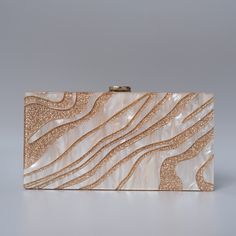 Looking for a stylish and chic statement accessory with a designer touch? You'll love this beautiful Luxury Resort Acrylic Clutch Bag! With its beautiful pearl sheen and its gold design, this stylish acrylic clutch bag won't go unnoticed. Simple and chic, it's the perfect accessory to dress up an outfit for a luxury resort feel. To wear on your way to the cocktail bar, the beach or by the pool, this beautiful acrylic clutch bag is perfect for all occasions and the holiday season! Style: Eclectic Clutch Purse Wedding, Purse Wedding, Eclectic Boho, Glitter Clutch, Acrylic Clutch, Striped Bags, Holiday Bag, Wedding Clutch, Box Clutch