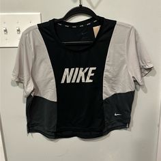 Nwt Color Block Short Sleeve Cropped Dri-Fit Nike Tshirt New With Tags, Never Worn Nike Gray Tops With Letter Print, Gray Crew Neck Athleisure Tops, Gray Sports Top With Graphic Print, Gray Graphic Print Sports Top, Nike Athleisure Tops With Letter Print, Nike Gray Sports Top, Gray Nike Sports Top, Nike Gray Sporty Top, Gray Letter Print Workout Top