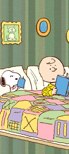 a person laying in bed reading a book with a dog sitting on the pillow next to them