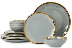 a set of gray and gold dinnerware