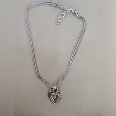 Vintage 925 Pandora Necklace With Triple Chain And Center Gold Plated Swinging Heart. Classic Heart Pendant Jewelry With Sterling Silver Clasp, Elegant Heart Pendant Jewelry With Sterling Silver Clasp, Elegant Silver Heart Necklace With Heart Beads, Elegant Open Heart Jewelry With Sterling Silver Clasp, Sterling Silver Heart Charm Necklace For Formal Occasions, Classic Silver Heart Pendant Necklace, Classic Silver Open Heart Jewelry, Formal Sterling Silver Heart Charm Necklace, Elegant Sterling Silver Jewelry With Heart Beads