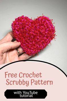 a hand holding a crochet heart with the text free crochet scrubby pattern