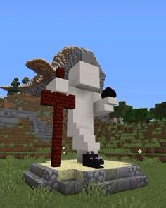 an image of a cross in the middle of a minecraft field with a bird on it