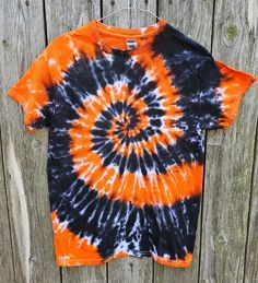 Spooky season is right around the corner! Be ready for the fall with this cyclone tee. Each shirt is unique in its own design since each shirt is hand dyed. The shirt above is similar to the shirt you will receive, but each shirt will have its own vibe of character. Handmade tie dye shirt made with permanent Procion fiber reactive dyes. Dyed on a 100% cotton Gildan T-shirt. The shirt has been pre-washed and rinsed several times to ensure the color will stay. Recommended to wash with dark or like colors in cold water, although washed several times already. Tumble dry low or air dry. Please contact me directly if any questions or if interested in a large quantity order. Halloween Tie-dye Casual T-shirt, Halloween Casual Tie Dye T-shirt, Casual Tie-dye Halloween Top, Casual Halloween Tie-dye T-shirt, Casual Halloween Tie Dye T-shirt, Casual Tie Dye Halloween Tops, Casual Tie Dye Tops For Halloween, Clothes For Teens