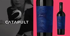 a bottle of catapult wine next to a woman