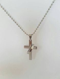 Cross necklace for men.This piece of jewelry is crafted in a high polish finish. Pendant features a satin finish cross with a matching ring. Cross pendant hangs from a 2mm bead chain necklace. Pendant and chain made in Italy.Message card of Holy Lady from Medjugorje included.***NOTE: We also have Custom Gift Cards, all You need to do after purchase isto send us message via "note to seller" with text You would like to write on Gift Card :)Feel free to contact me if you have questions or any speci Stainless Steel Cross Pendant Jewelry For Anniversary, Stainless Steel Cross Pendant Necklace For Gift, Gift Stainless Steel Cross Pendant Necklace, Stainless Steel Cross Necklace For Anniversary, Minimalist Stainless Steel Cross Pendant Jewelry, Elegant Stainless Steel Cross Necklace As Gift, Wedding Jewelry With Cross Pendant, White Gold Cross Pendant Necklace For Wedding, Personalized Stainless Steel Cross Jewelry