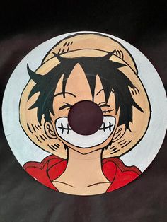 a paper plate with a cartoon character painted on it