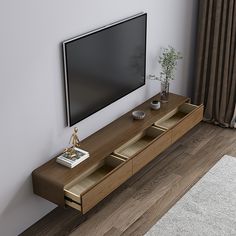 a flat screen tv sitting on top of a wooden entertainment center