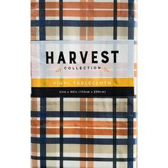 the harvest collection plaid table cloth in orange, white and blue is shown on a white background