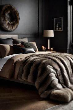 a bedroom with black walls and fur on the bed