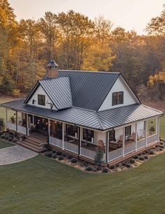 a large white house with a metal roof