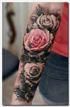 a woman with a rose tattoo on her arm