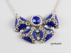 An necklace in a royal blue color is a handmade jewelry from delicate very small Japanese beads. The necklace is not massive but it catches every eye with its color and its shape reminds a butterfly. In a center of the necklace is a glittering blue Swarovski rivoli. Size/Dimensions Length approximately = 45 cm (17,7 inches) + 5 cm (2 inches) extension chain (chain can be extended on demand) Central peace = width of the center part = 5,3 cm (2,1 inches); height = 4 cm (1,6 inches) Material Japane Elegant Blue Beaded Necklaces With Bead Caps, Blue Pendant Jewelry With Faceted Beads, Elegant Blue Jewelry With Bead Caps, Royal Blue Round Beads Necklace For Gift, Royal Blue Jewelry, Beaded Projects, Sodalite Necklace, Blue Statement Necklace, Blue Stone Necklace