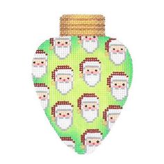 a cross stitch ornament with santa clauss on green and brown fabric, in the shape of a christmas baub