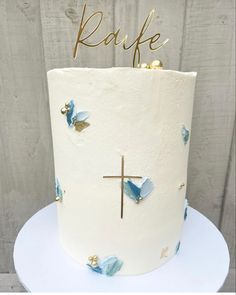 a white cake with blue and gold decorations