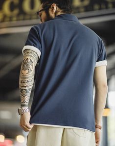 Step up your style game this summer with our American Workwear Retro Embroidered Polo! This isn’t just another men's t-shirt; it's your new go-to for both comfort and style. Crafted in a rich navy blue, it perfectly balances classic and casual. We've knitted this piece to keep you cool with a breathable blend of 61.4% cotton and 38.6% polyester fiber, ensuring both comfort and durability. Whether you’re hitting the town or heading to a barbecue, the lightweight fabric works hard to keep you fresh and at ease all day long. Forget about standard fits that cling or hang loose. Our polo comes in a range of sizes—from S to 2XL—with a standard fit that sits just right. Not too tight, not too loose. Just the confident look you need for every day. The short sleeves and lapel collar add a neat, pol Sporty Polo Collar T-shirt For Summer, Navy Cotton Polo Shirt With Short Sleeves, Navy Short Sleeve Cotton Polo Shirt, Navy Cotton Short Sleeve Polo Shirt, Summer Polo Collar Top For Streetwear, Summer Streetwear Polo Collar Top, Summer Polo Collar T-shirt For Streetwear, Summer Polo Shirt For Streetwear, Summer Crew Neck Polo Shirt For Streetwear